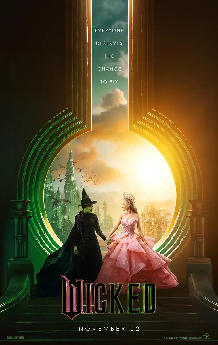 Home Filmposter voor "Wicked", met twee personages die elkaars hand vasthouden: de een gekleed in het zwart met een punthoed, en de ander in een roze jurk. De achtergrond toont een magisch stadsgezicht met de tekst "Iedereen verdient de kans om te vliegen" en de releasedatum, 22 november. Stream het via IPTV Nederland!